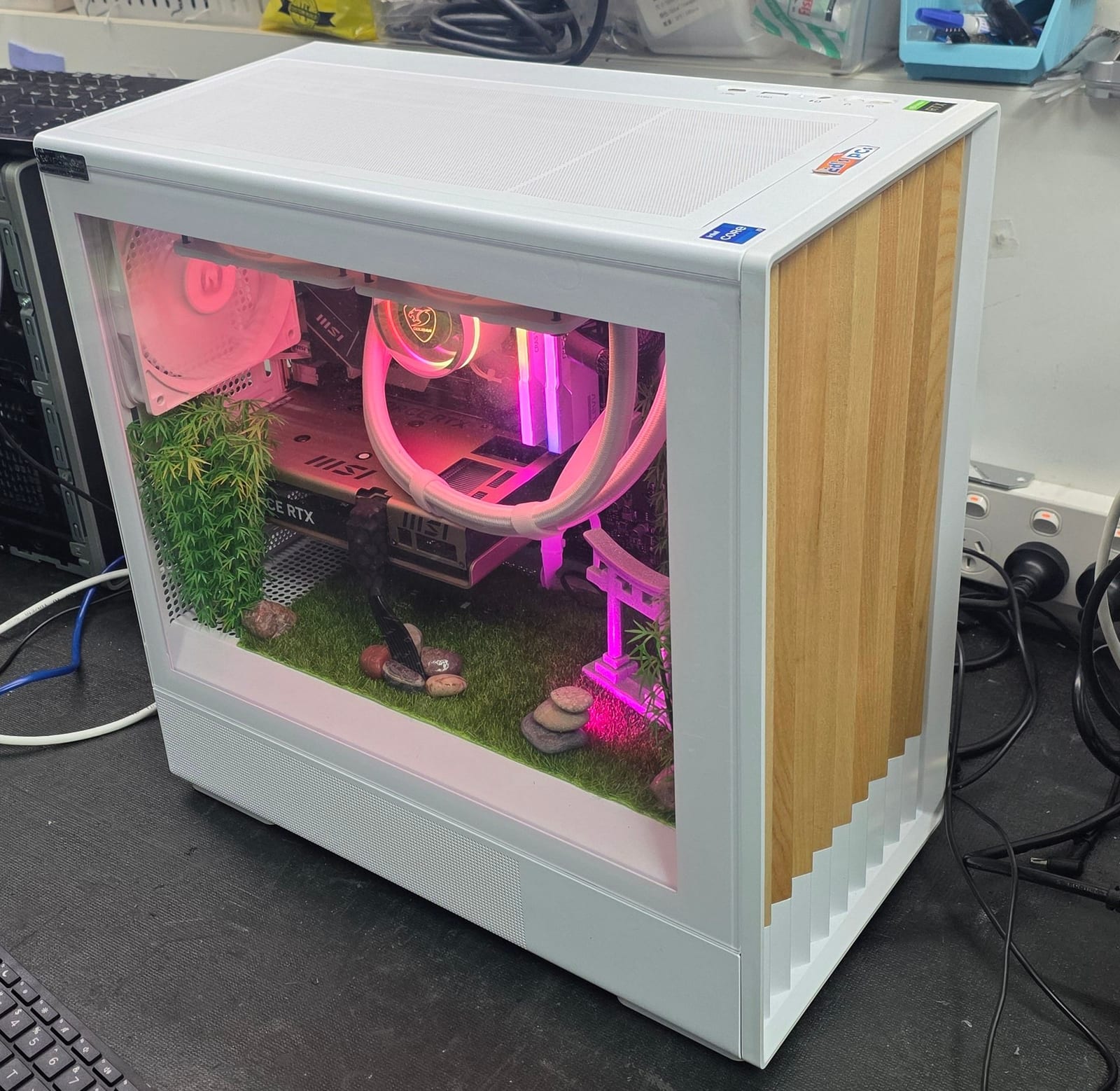 Angled view of the white case showing the timber-slat side panel