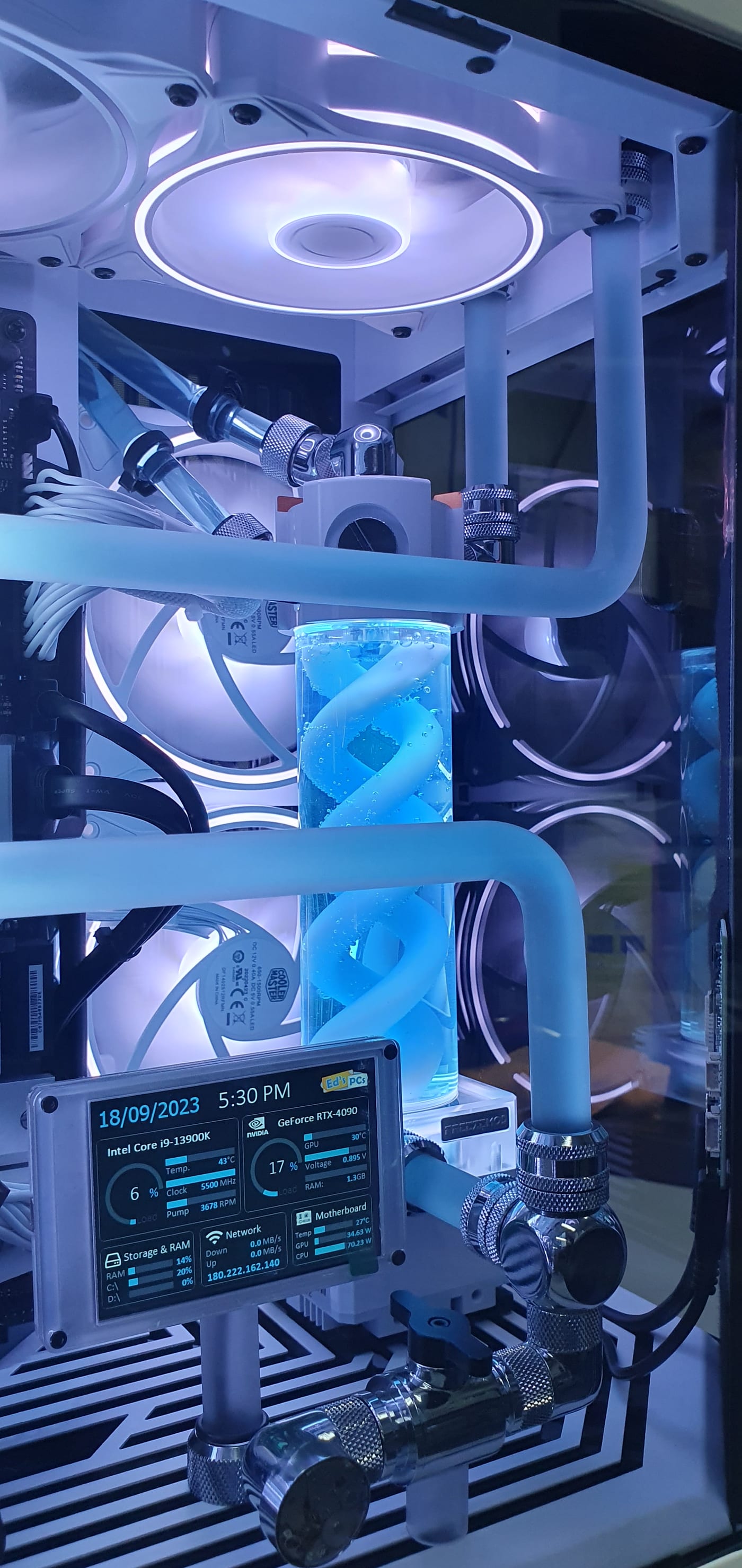 A vertical view into the case chamber showing the distribution plate, hard tubing and the sensor panel mounted above it