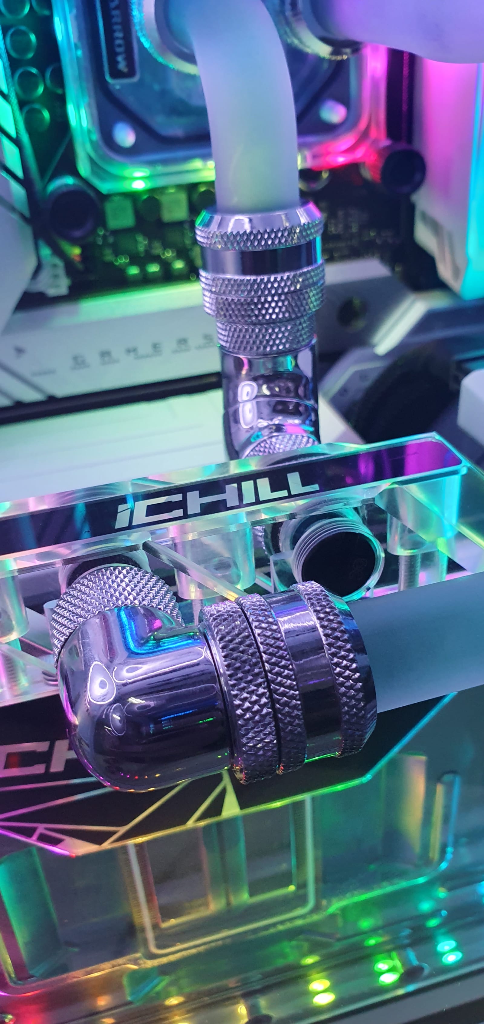 A macro shot of a chrome compression fitting on the hard-line loop