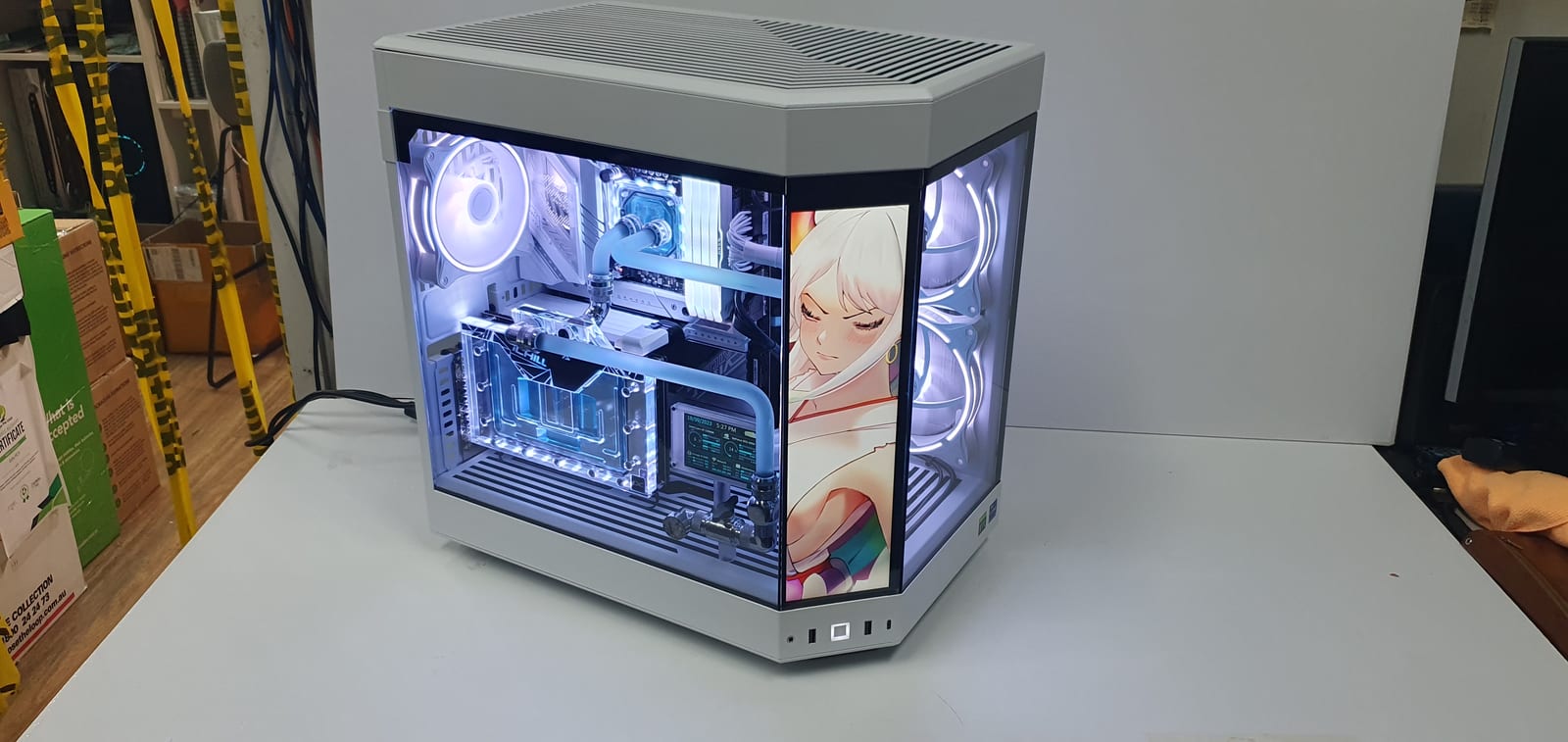 A wider angle of the same build showing the portrait art panel and hard-line loop from the front corner