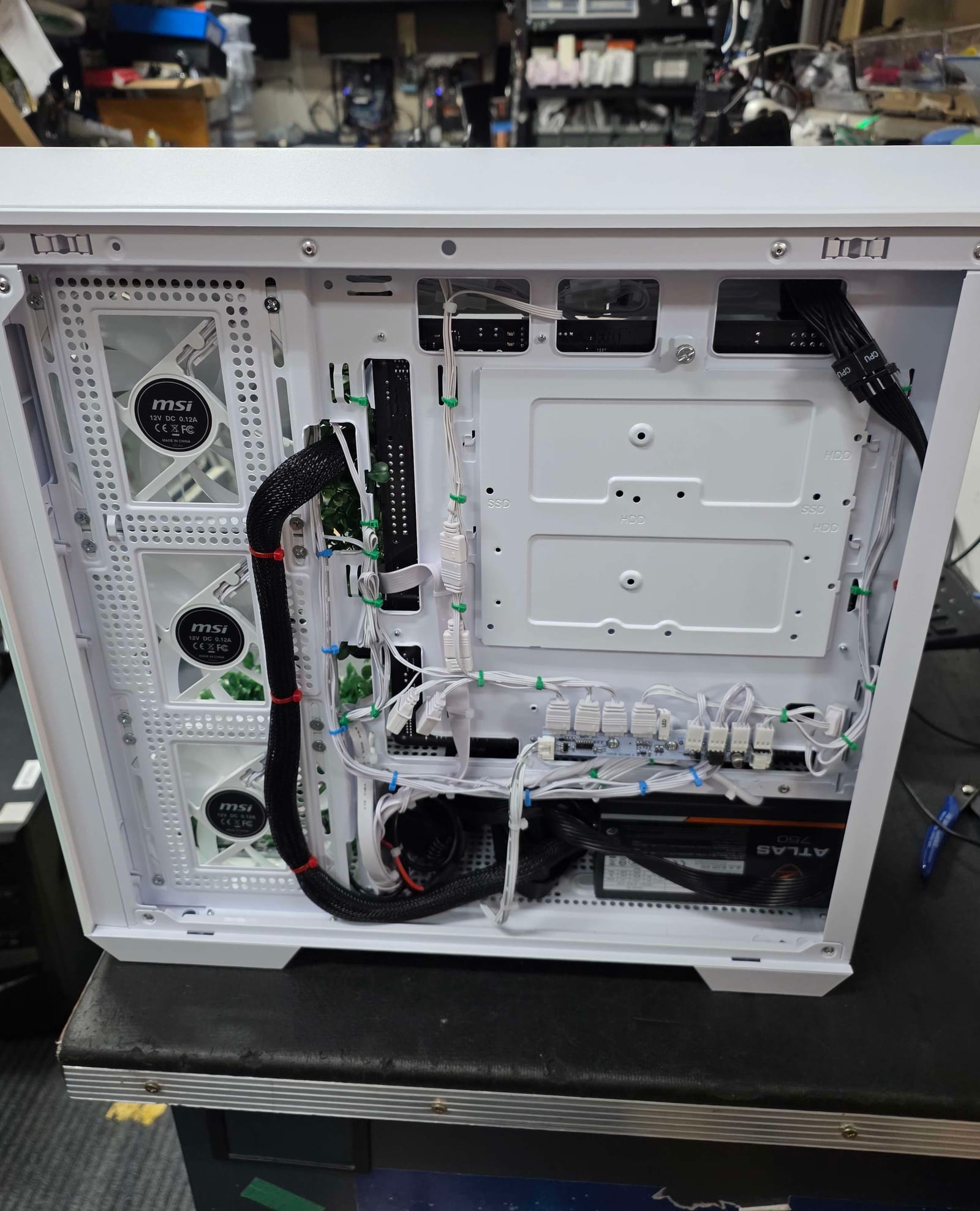 The rear of the case with cables routed and zip-tied by colour, matching the standard applied to every build