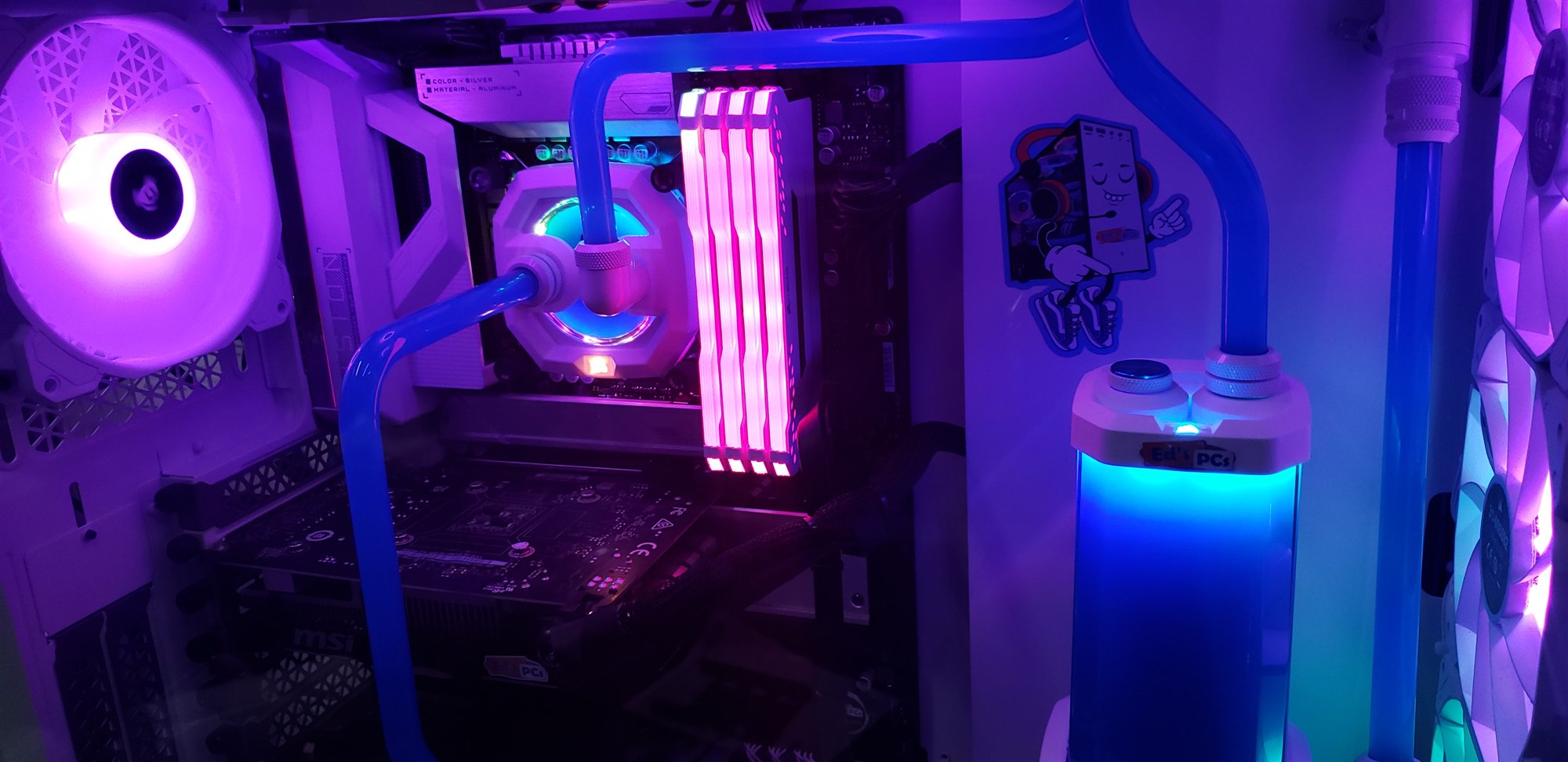 A CPU water block and RGB memory inside a white build, with an Ed's PCs sticker on the reservoir