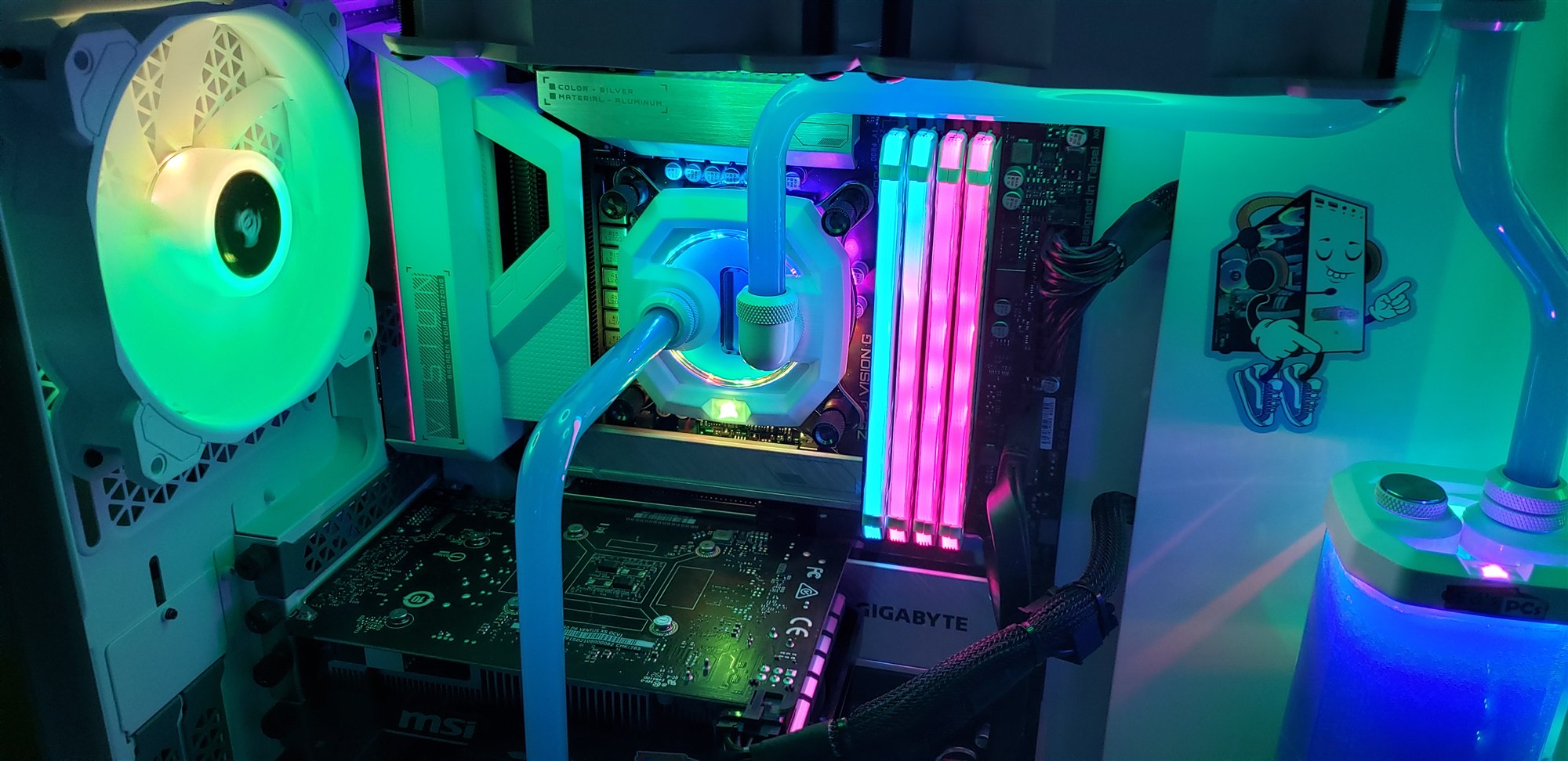 Close view of the CPU block, RGB memory and white radiator fans lit in green and pink