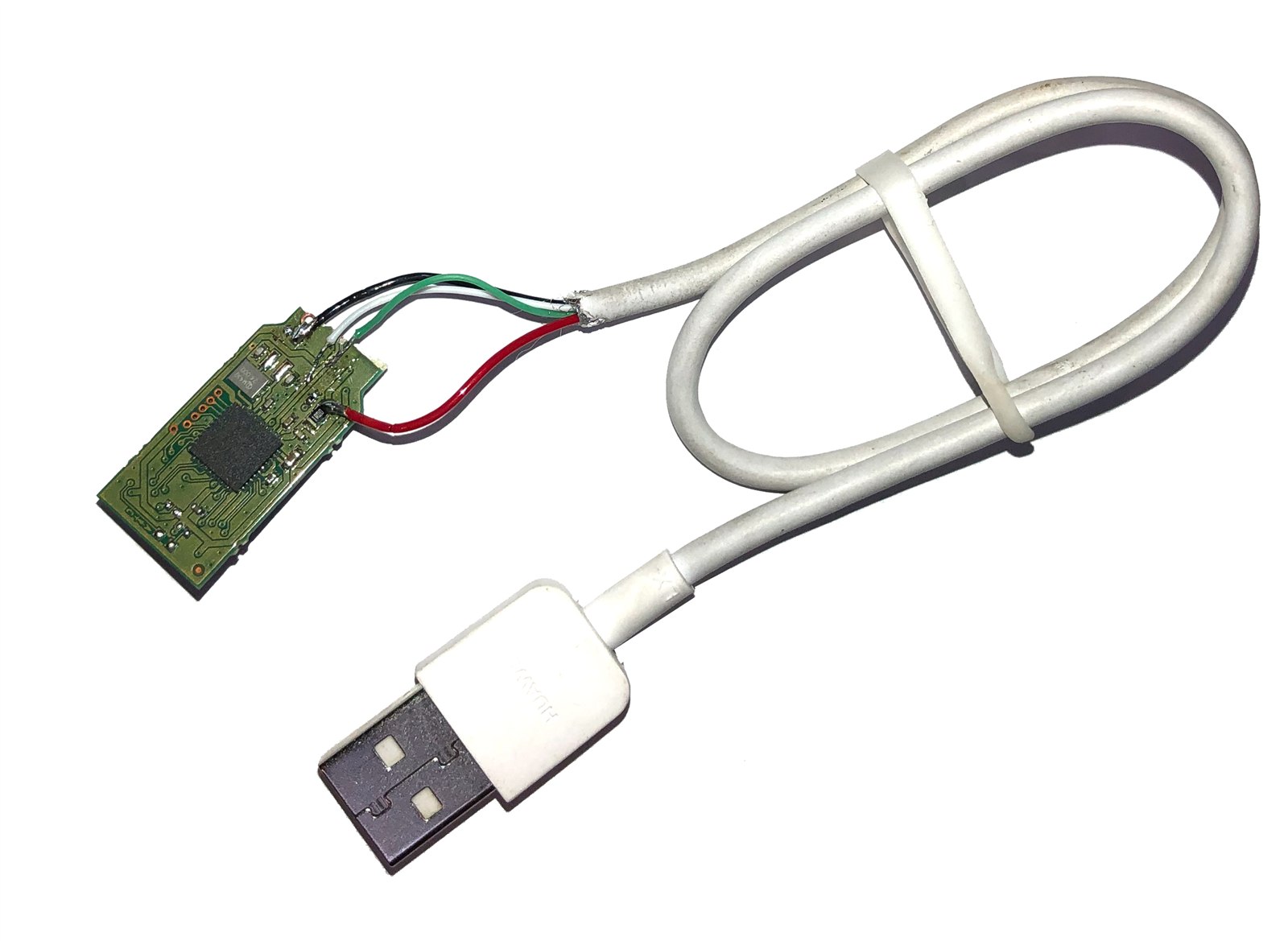 A snapped USB drive with a replacement cable hand-soldered directly onto the circuit board pads